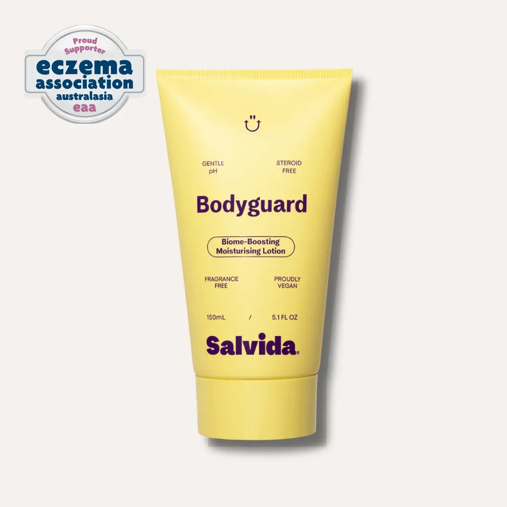 Salvida Bodyguard Biome-Boosting Moisturising Lotion, a 150 mL yellow tube, with the Eczema Association Australasia proud supporter badge