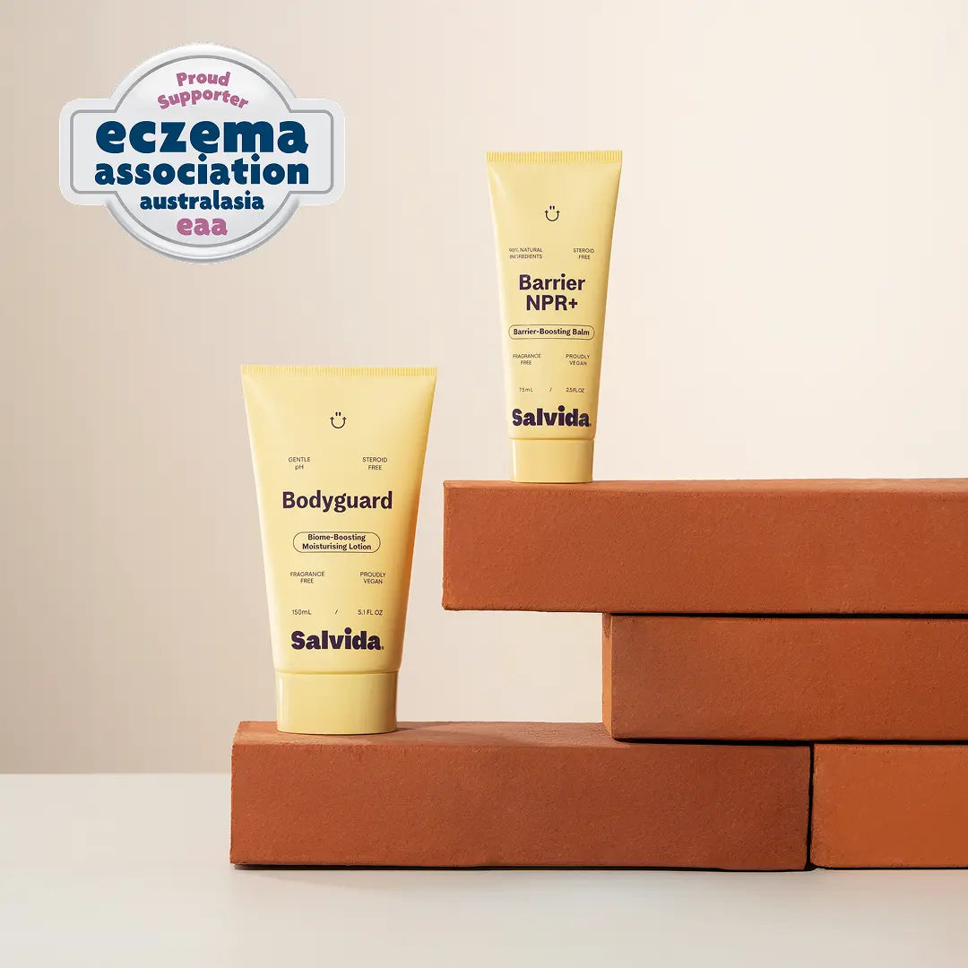 Two tubes of Salvida skincare products on a beige background with an Eczema Association logo.